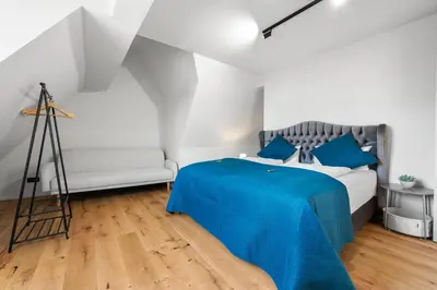 Ein Bett oder Betten in einem Zimmer der Unterkunft LiT LiVING Grünstadt - Luxury- style Boutique Apartments