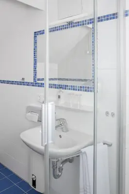 Ein Badezimmer in der Unterkunft Hotel Kredell