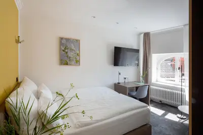 Ein Bett oder Betten in einem Zimmer der Unterkunft Hotel Kredell