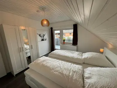 Ein Bett oder Betten in einem Zimmer der Unterkunft Odenwaldpanorama