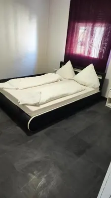 Ein Bett oder Betten in einem Zimmer der Unterkunft 7 Zimmer Haus in Kaiserslautern