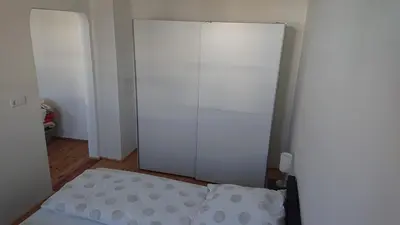 Ein Bett oder Betten in einem Zimmer der Unterkunft Ferienwohnung Weinstraßenmitte