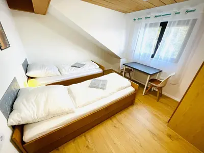 Ein Bett oder Betten in einem Zimmer der Unterkunft Pension Spatzennest