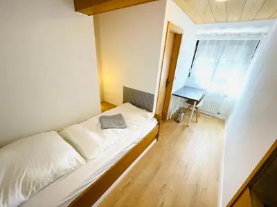 Ein Bett oder Betten in einem Zimmer der Unterkunft Pension Spatzennest
