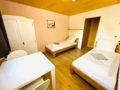 Ein Bett oder Betten in einem Zimmer der Unterkunft Pension Spatzennest