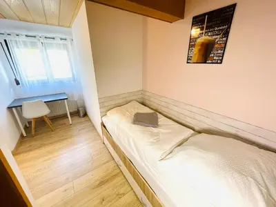 Ein Bett oder Betten in einem Zimmer der Unterkunft Pension Spatzennest