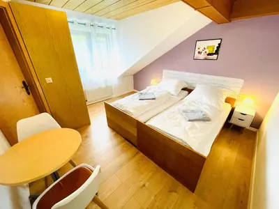 Ein Bett oder Betten in einem Zimmer der Unterkunft Pension Spatzennest