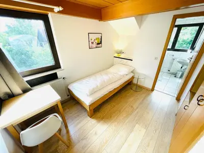 Ein Bett oder Betten in einem Zimmer der Unterkunft Pension Spatzennest