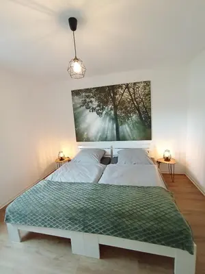 Ein Bett oder Betten in einem Zimmer der Unterkunft Ferienwohnung Casa Rockstein