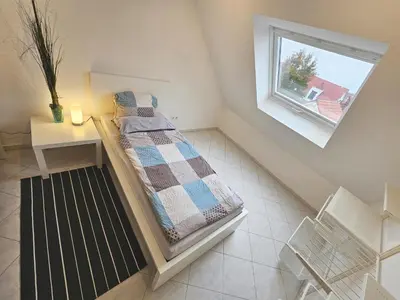 Ein Bett oder Betten in einem Zimmer der Unterkunft Solaris Ferienwohnung 53qm Netflix Glasfaser 76771 Hördt