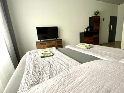 Ein Bett oder Betten in einem Zimmer der Unterkunft Goldstadt Classic Suite - City Apartament am Schlössle