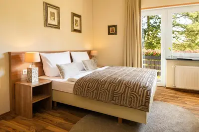 Ein Bett oder Betten in einem Zimmer der Unterkunft Gästehaus Luise