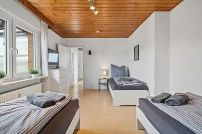 Ein Bett oder Betten in einem Zimmer der Unterkunft RI01 Apartment mit großem Balkon
