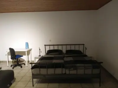 Ein Bett oder Betten in einem Zimmer der Unterkunft Ferienwohnung Wetterisch