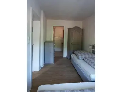 Ein Bett oder Betten in einem Zimmer der Unterkunft Holiday apartment Bambi in the house at the linden