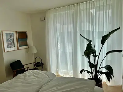 Ein Bett oder Betten in einem Zimmer der Unterkunft Schickes 2-Zi-Apartment am Neckarufer im BUGA-Park