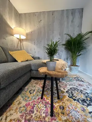 Ein Sitzbereich in der Unterkunft Moderne, helle Terrassenwohnung im Kurort