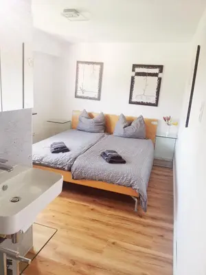 Ein Bett oder Betten in einem Zimmer der Unterkunft Ferienwohnung Bergblick