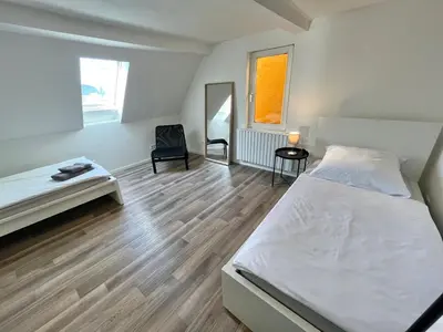 Ein Bett oder Betten in einem Zimmer der Unterkunft 90qm Ferienhaus Lorsch