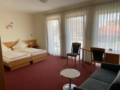 Ein Bett oder Betten in einem Zimmer der Unterkunft Pension Zum Bahnhof