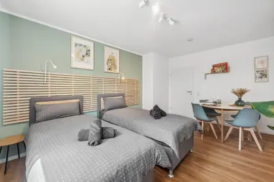 Ein Bett oder Betten in einem Zimmer der Unterkunft Amalfi A07 - 4 PP - 2 Zi - smart TV - Boxspringbett