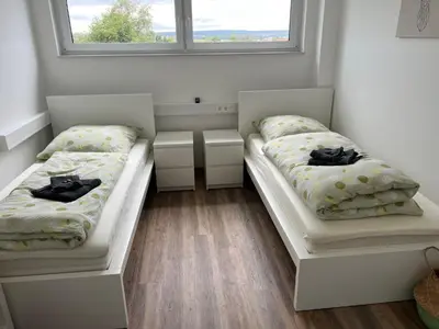 Ein Bett oder Betten in einem Zimmer der Unterkunft Boardinghouse Friolzheim
