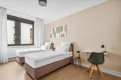 Ein Bett oder Betten in einem Zimmer der Unterkunft FABYLOUS Homes City Apartment I Gruppen I Waschtrockner I Balkon I belebte Lage