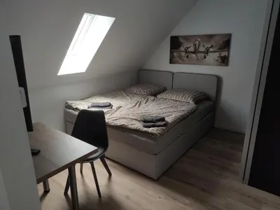 Ein Bett oder Betten in einem Zimmer der Unterkunft Apartments Leimen