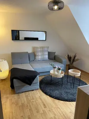 Ein Sitzbereich in der Unterkunft Ferienwohnung am Kelterplatz