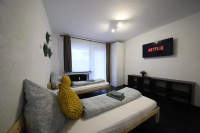 Ein Bett oder Betten in einem Zimmer der Unterkunft NEW Luxury Apartment in Heilbronn Neckarsulm