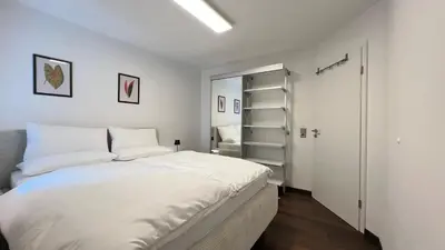 Ein Bett oder Betten in einem Zimmer der Unterkunft LudwigsHome - Zentral, 120qm, Kostenloser Parkplatz, Terrasse, SmartTV