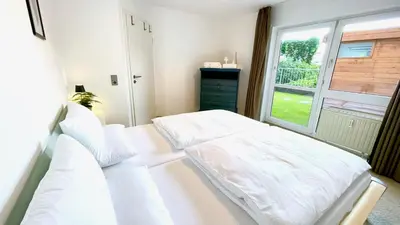 Ein Bett oder Betten in einem Zimmer der Unterkunft LudwigsHome - Zentral, 120qm, Kostenloser Parkplatz, Terrasse, SmartTV
