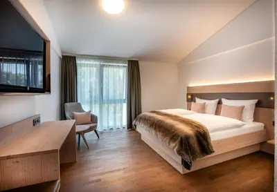 Ein Bett oder Betten in einem Zimmer der Unterkunft Landhotel Grüner Wald