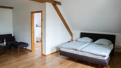 Ein Bett oder Betten in einem Zimmer der Unterkunft Hotel Rhodter Adler