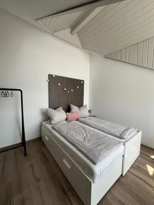 Ein Bett oder Betten in einem Zimmer der Unterkunft Moderne Wohnung mit Dachterrasse