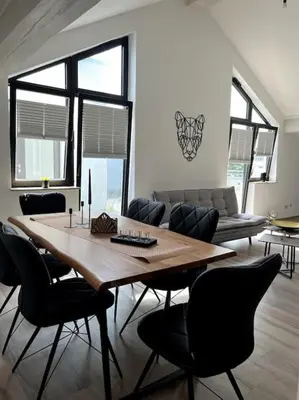 Ein Sitzbereich in der Unterkunft Moderne Wohnung mit Dachterrasse