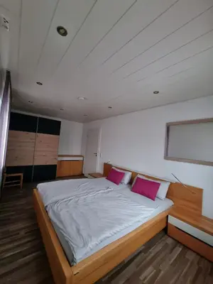 Ein Bett oder Betten in einem Zimmer der Unterkunft Ferienwohnung Elsenztal
