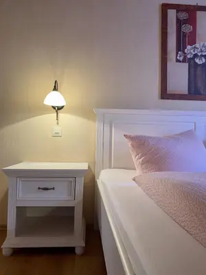 Ein Bett oder Betten in einem Zimmer der Unterkunft Pension Walther