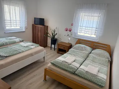 Ein Bett oder Betten in einem Zimmer der Unterkunft Pfalzgrün - Wohnen mit Stil