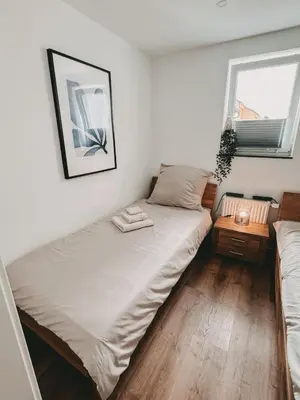 Ein Bett oder Betten in einem Zimmer der Unterkunft Melem Apartments