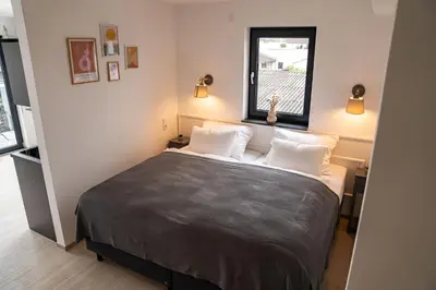 Ein Bett oder Betten in einem Zimmer der Unterkunft DOM Inn