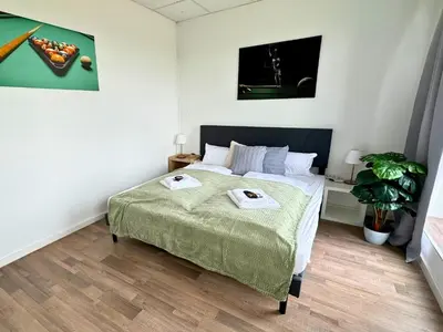 Ein Bett oder Betten in einem Zimmer der Unterkunft Design Penthouse - 4SZ - 2Bäder - Whirlpool - 2 Parkplätze - Dachterrasse