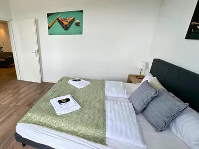 Ein Bett oder Betten in einem Zimmer der Unterkunft Design Penthouse - 4SZ - 2Bäder - Whirlpool - 2 Parkplätze - Dachterrasse
