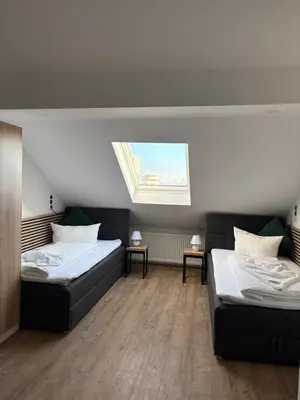 Ein Bett oder Betten in einem Zimmer der Unterkunft Hotel Montenegro