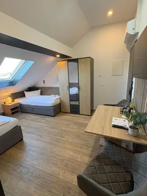 Ein Bett oder Betten in einem Zimmer der Unterkunft Hotel Montenegro