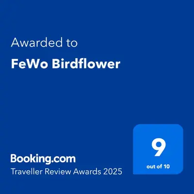 Ein Zertifikat, Auszeichnung, Logo oder anderes Dokument, das in der Unterkunft FeWo Birdflower ausgestellt ist