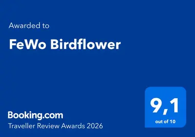 Ein Zertifikat, Auszeichnung, Logo oder anderes Dokument, das in der Unterkunft FeWo Birdflower ausgestellt ist