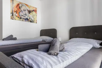 Ein Bett oder Betten in einem Zimmer der Unterkunft LIVINGBOXX Karlsruhe - Messe I neuwertige Apartments mit Küche