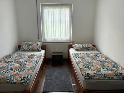 Ein Bett oder Betten in einem Zimmer der Unterkunft Ferienwohnung Grimm 3