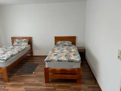 Ein Bett oder Betten in einem Zimmer der Unterkunft Ferienwohnung Grimm 3